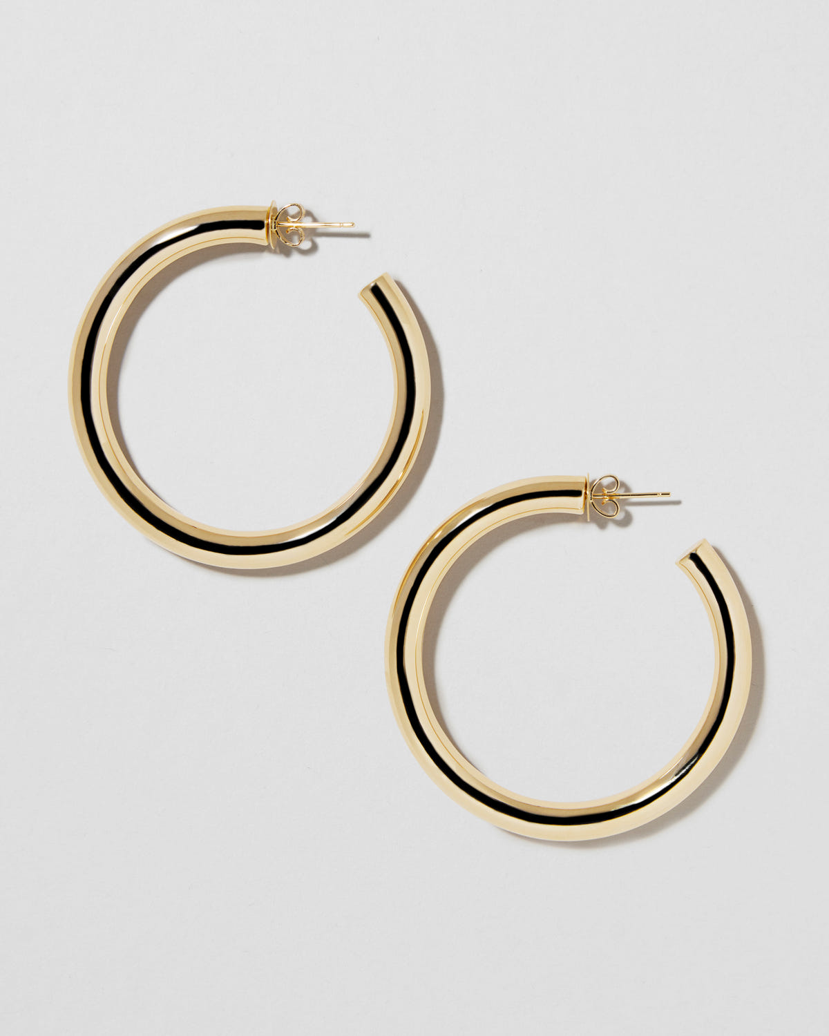 1.5" Natasha Hoops in 14K Yellow Gold earring - close-up detail | gold hoop earrings