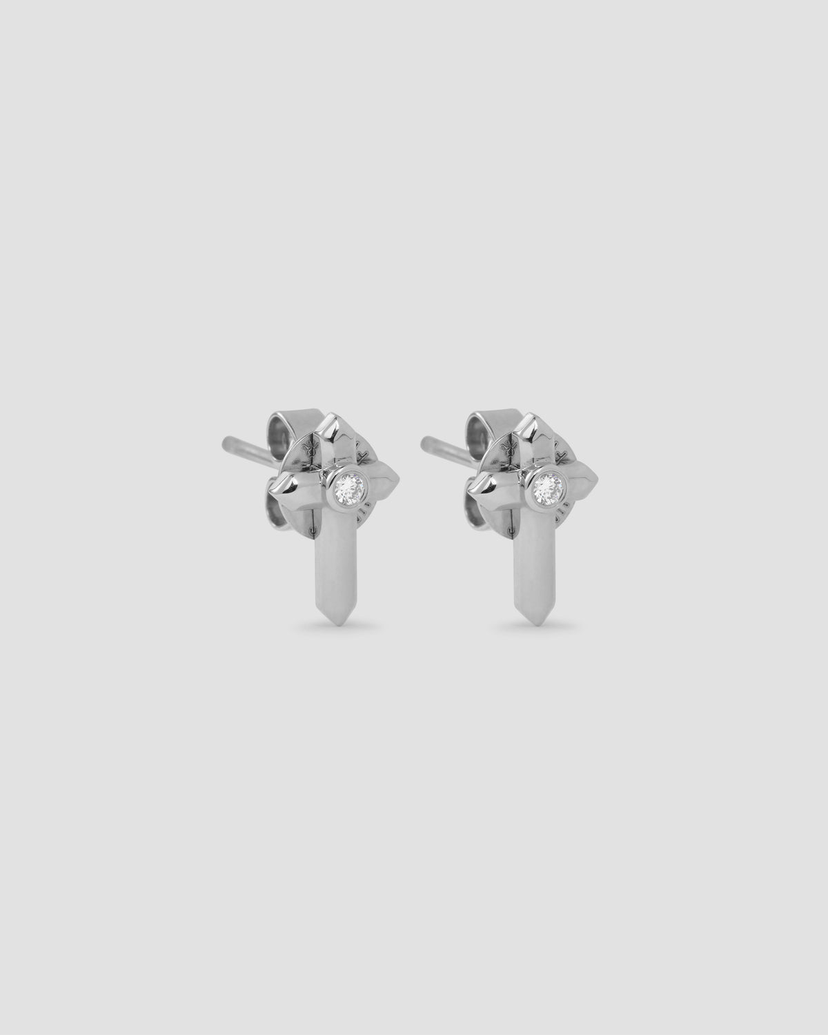 Cross Stud gold earring - alternate angle | diamond stud earrings