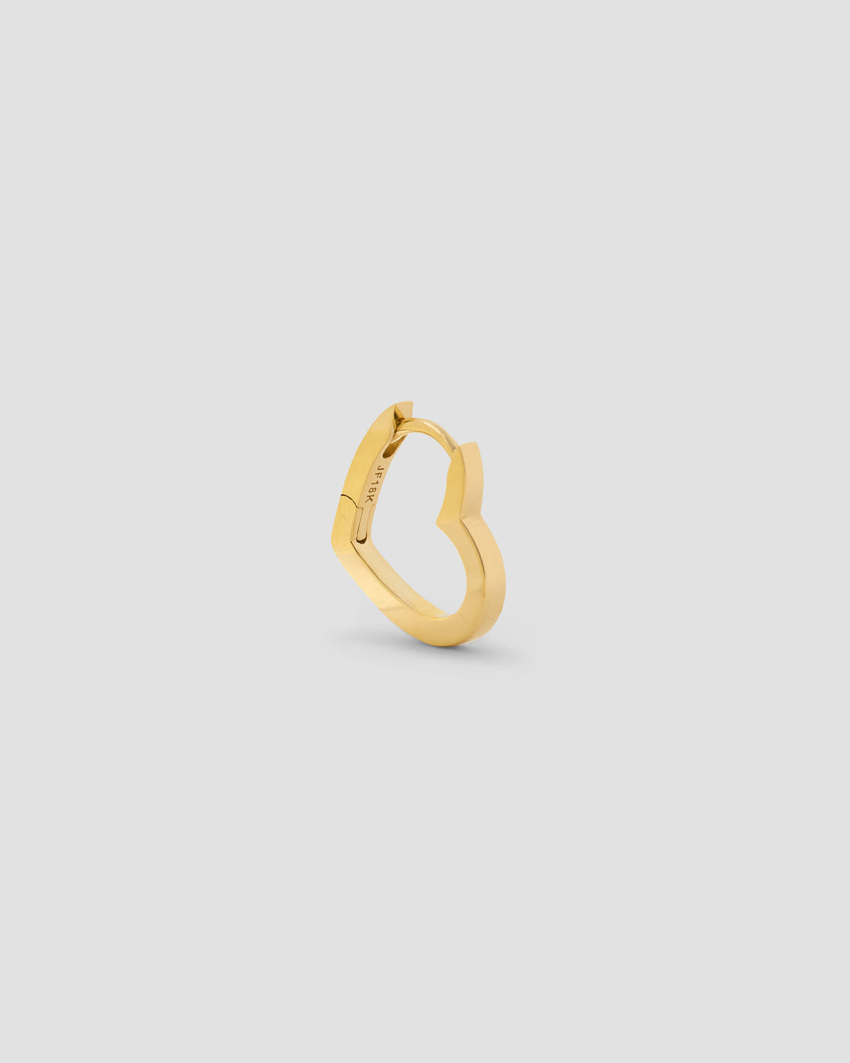 18k Small Heart Huggie earring - styled on model | gold huggie earrings