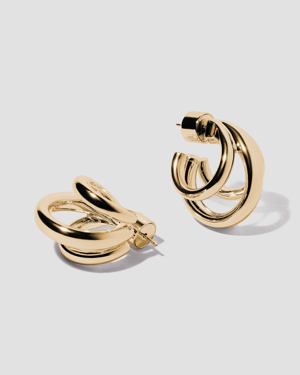 Triple Lilly Huggies earring - alternate angle | gold huggie earrings