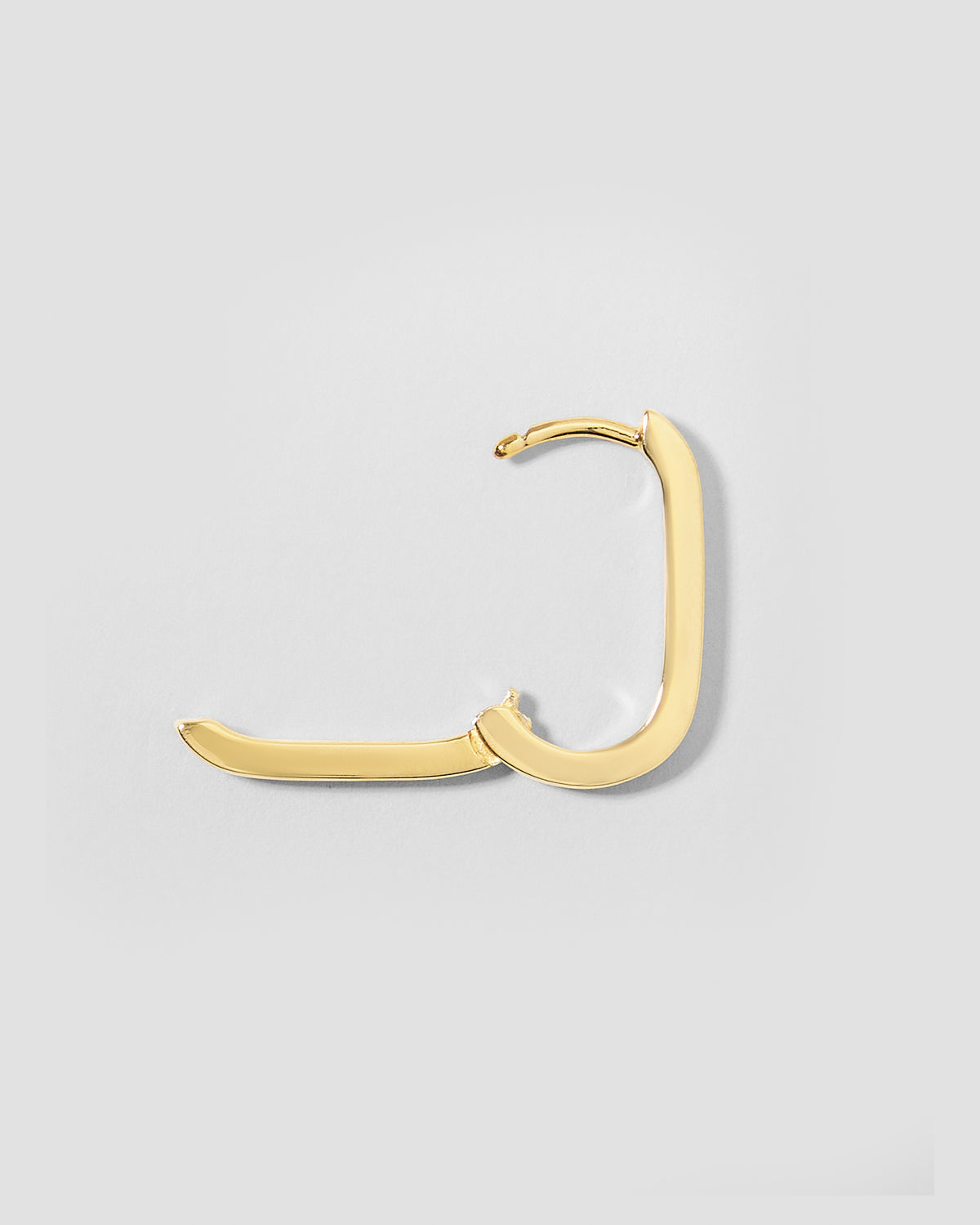 18k Elongated Link Huggie earring - styled on model | gold huggie earrings