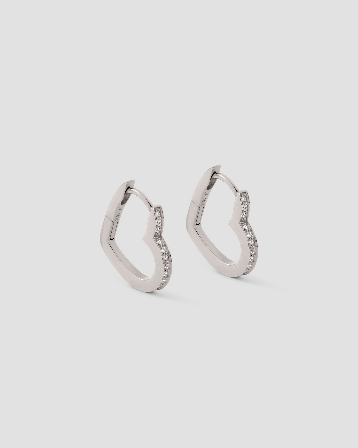 18k Small Heart Huggie With Pavé White Diamonds gold earring - product detail shot | diamond huggie earrings