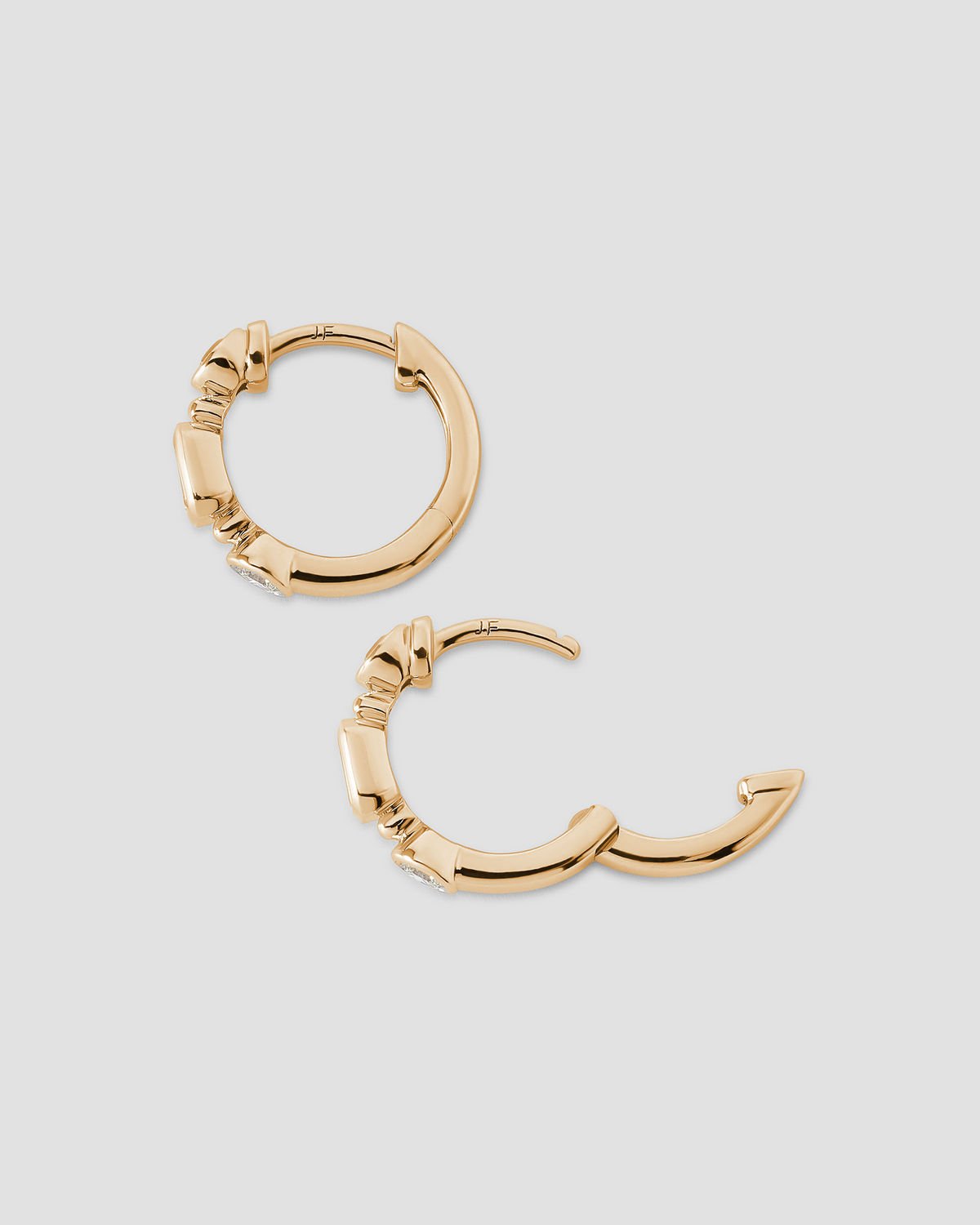 Essential Mixed Shape Diamond Bezel Huggie gold earring - styled on model | diamond huggie earrings