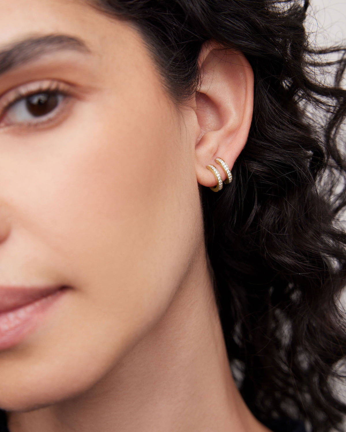 18k Extra Small Huggie with Pavé Diamonds 18K gold earring - side view | diamond huggie earrings