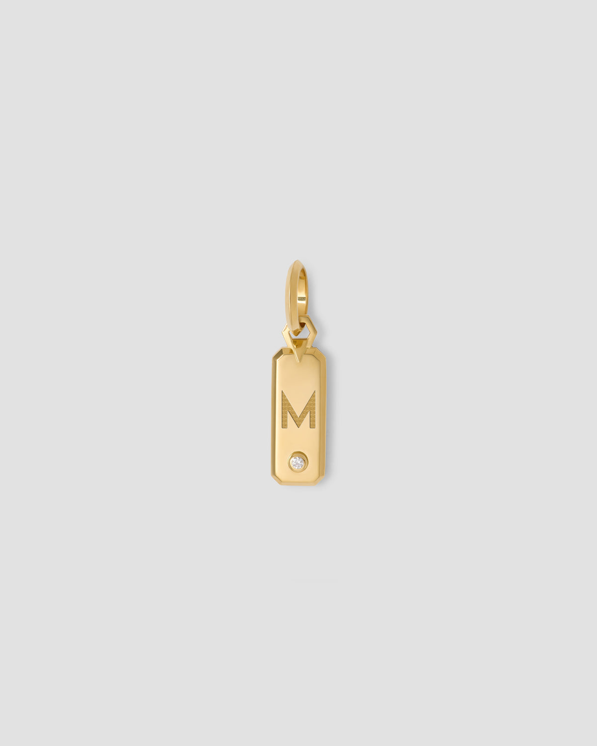 Minimal Block Letter Dog Tag in 18K Yellow gold charm - product detail shot | necklace with charms