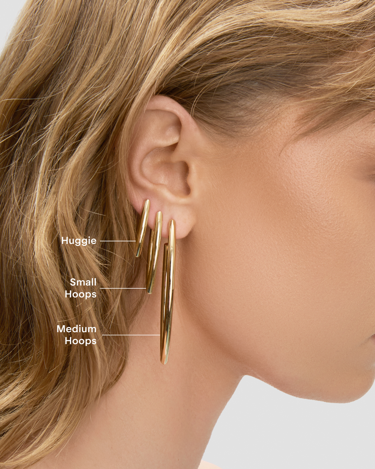 Marquise Huggies earring - styled on model | gold huggie earrings