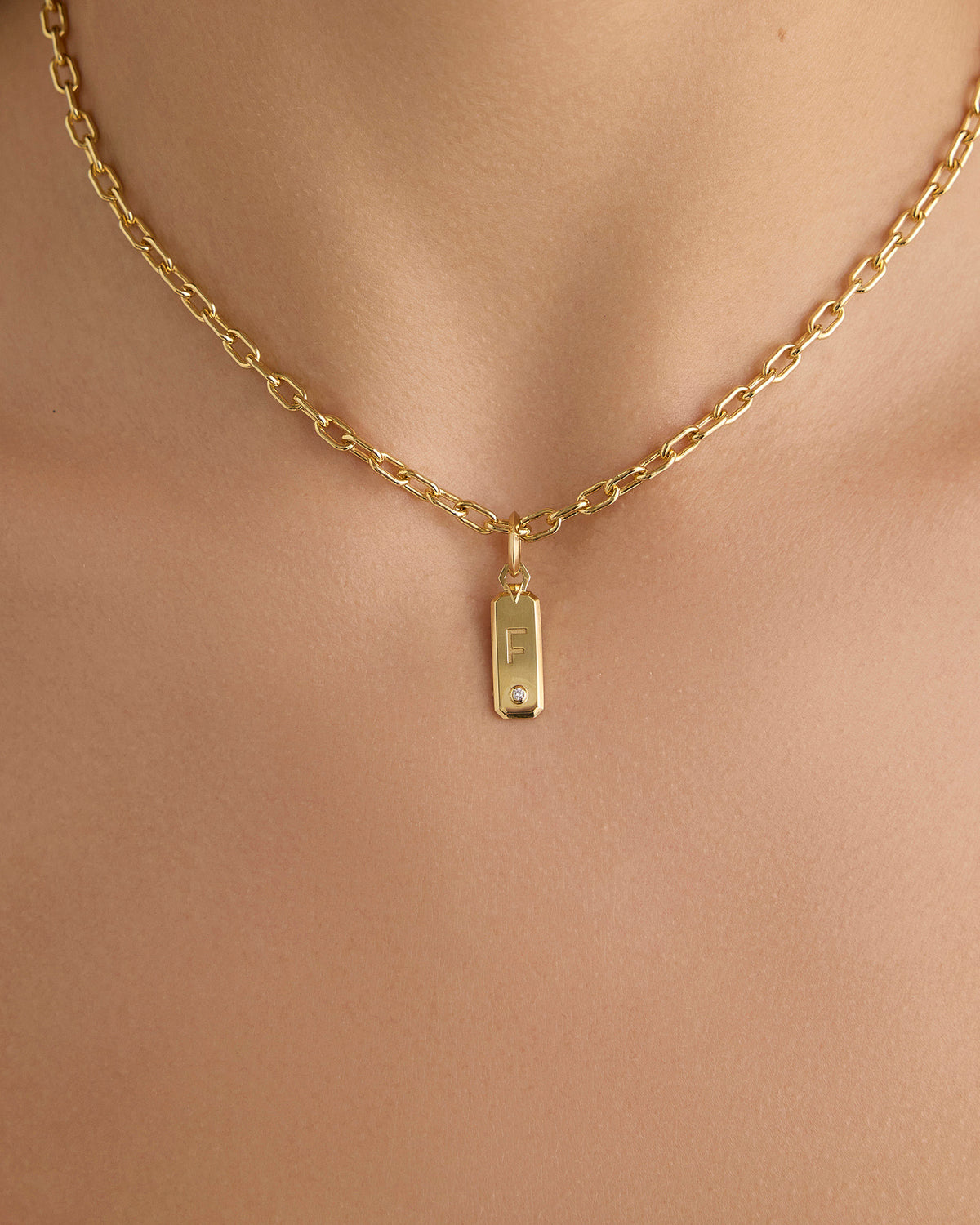 Minimal Block Letter Dog Tag in 18K Yellow gold charm - styled on model | necklace with charms