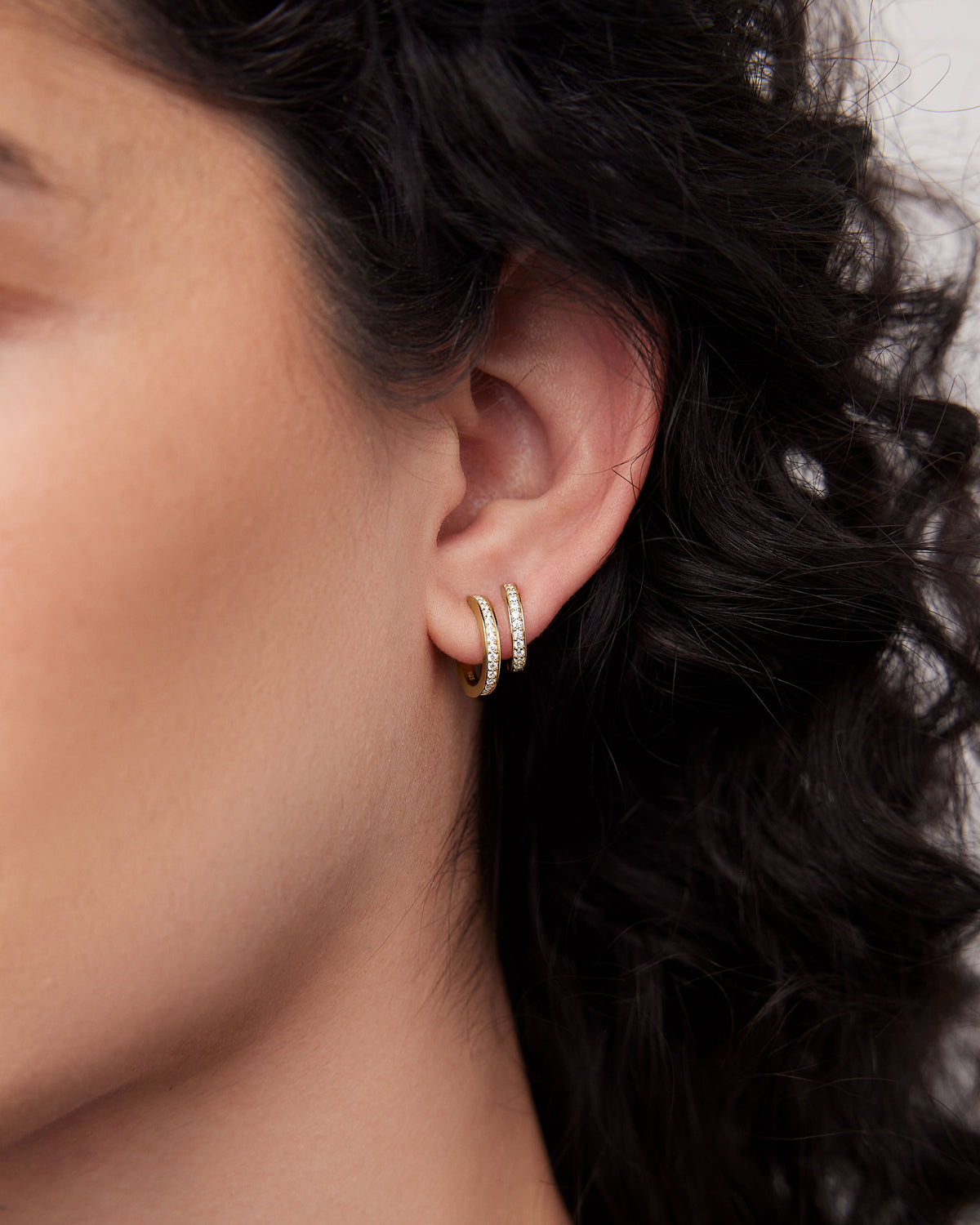 18k Extra Small Huggie with Pavé Diamonds 18K gold earring - alternate angle | diamond huggie earrings