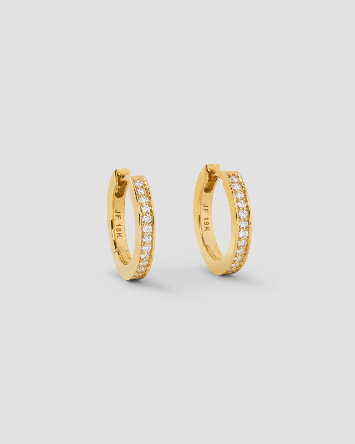 18k Small Huggie with Pavé Diamonds 18K gold earring - front view | diamond huggie earrings