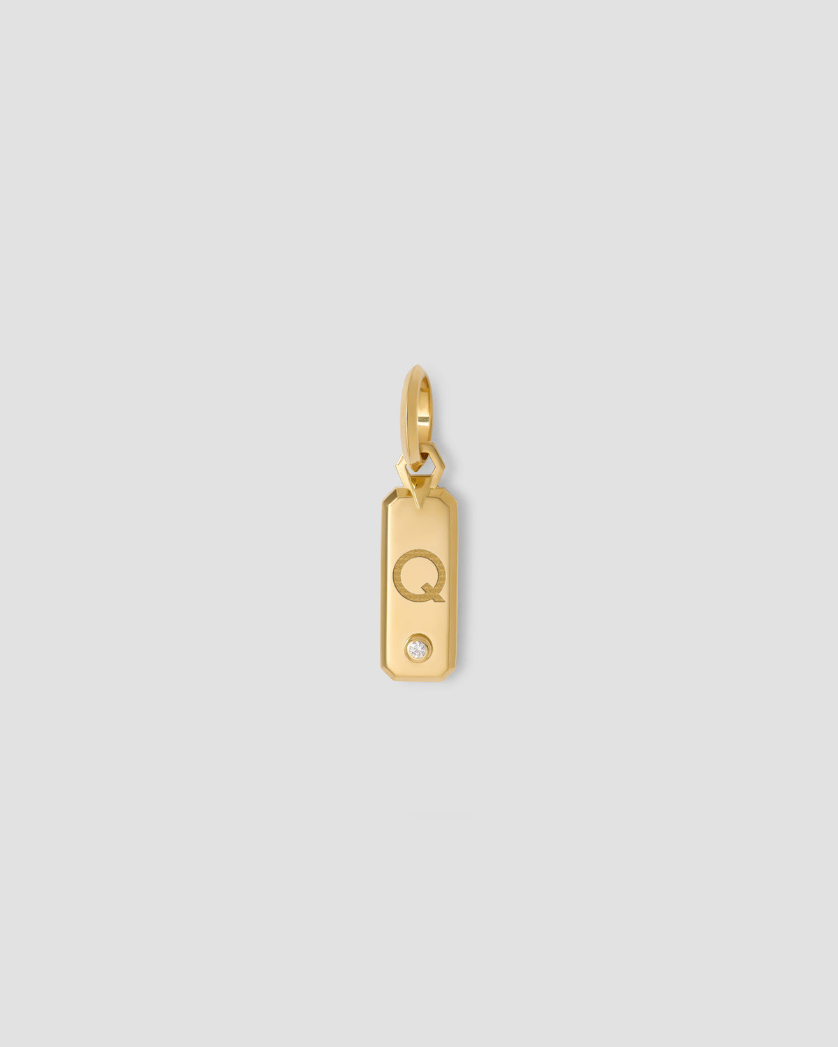 Minimal Block Letter Dog Tag in 18K Yellow gold charm - alternate angle | necklace with charms