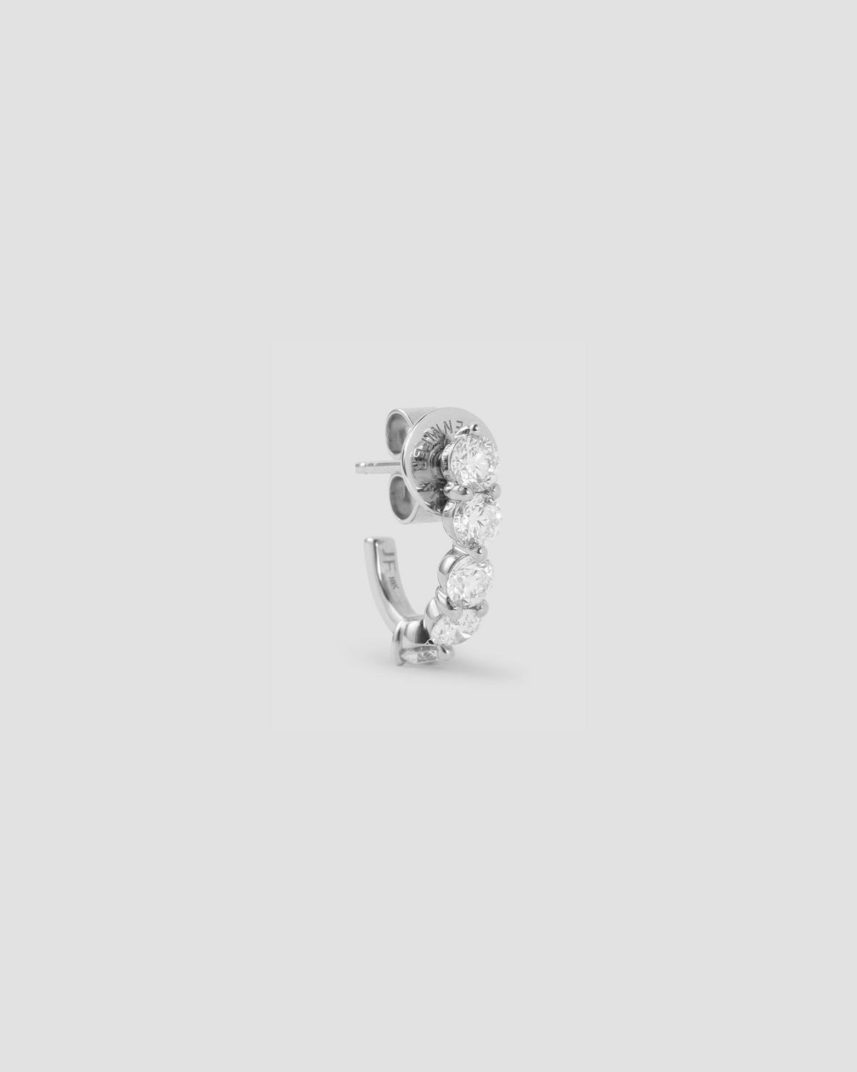 Floating Five Diamond Huggies 18K gold earring - product detail shot | diamond huggie earrings