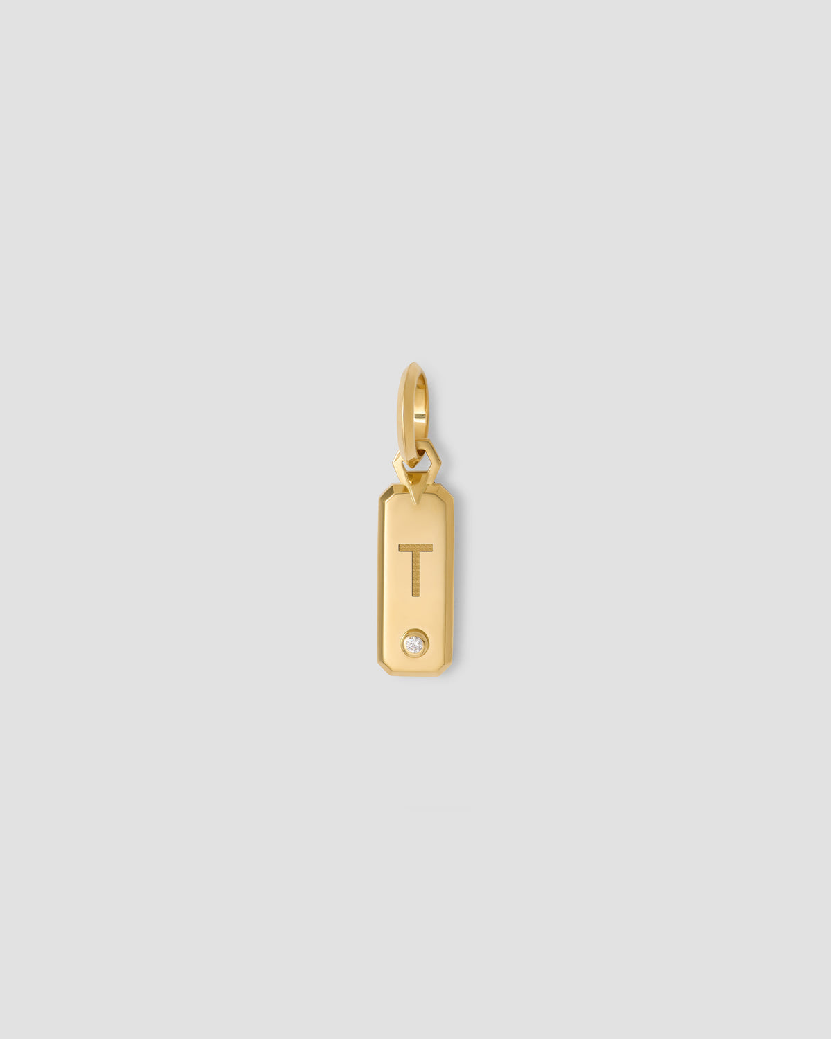 Minimal Block Letter Dog Tag in 18K Yellow gold charm - product detail shot | necklace with charms