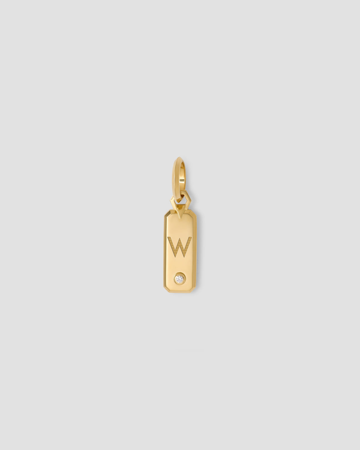 Minimal Block Letter Dog Tag in 18K Yellow gold charm - close-up detail | necklace with charms